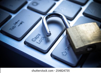 Open Security Lock On Computer Keyboard - Computer Security Breach Concept