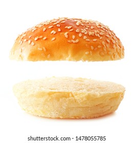 Open Sesame Seed Hamburger Bun On A White Background. Top And Bottom Isolated With Copy Space.