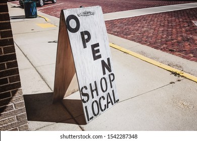 Open Shop Local Sign On A Wooden Sandwich Board Outside Of A Store