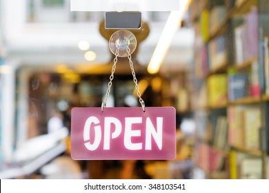 Open Sign On The Door Of Bookstore.