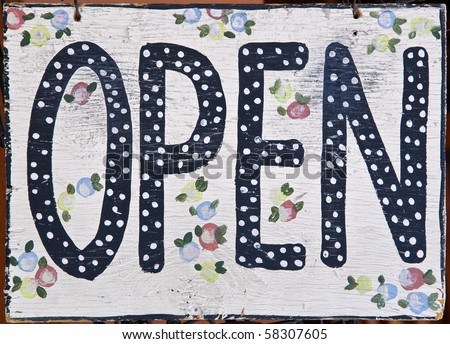 Open sign in store window - closeup