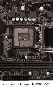 Open socket for processor on motherboard for office PC, close up view. 