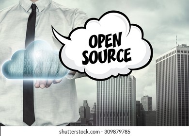 Open source text on cloud computing theme with businessman on cityscape background - Powered by Shutterstock - Get 15% off with code: PIKWIZARD15