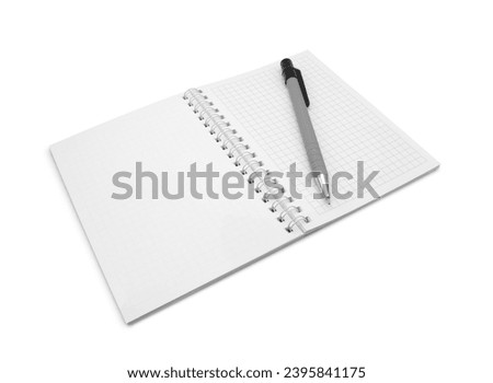 Open spiral bound notepad or notebook with square and blank sheets and pen on top, isolated on white background side view                               
