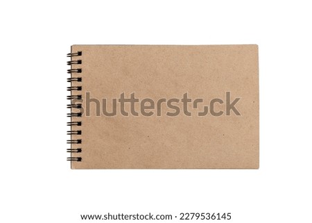 Open spring notepad with craft brown sheets. Creativity and drawing. Close-up. Isolated on a white background. Top view. Space for text.
