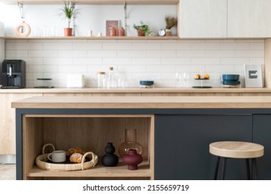 Open Storage Cabinet With Vase, Home Decor And Breakfast Tray On Shelf. Contemporary Apartment With New Kitchen Furniture, Countertop, Bar Chair And Upscale Interior Design Against Blurred Background