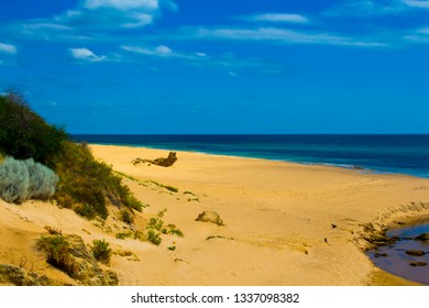 Open Storm Water Drain In The City Of Bunbury, Western Australia Flows Into The Indian Ocean On Ocean Beach And Extends For Many Kilometers Through The City's Urban  Landscape.