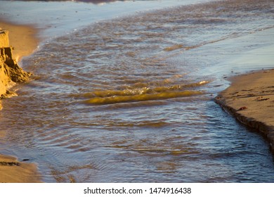 Open Storm Water Drain In The City Of Bunbury, Western Australia Flows Into The Indian Ocean On Ocean Beach And Extends For Many Kilometers Through The City's Urban  Landscape.