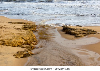 Open Storm Water Drain In The City Of Bunbury, Western Australia Flows Into The Indian Ocean On Ocean Beach And Extends For Many Kilometers Through The City's Urban  Landscape.