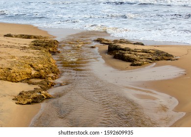 Open Storm Water Drain In The City Of Bunbury, Western Australia Flows Into The Indian Ocean On Ocean Beach And Extends For Many Kilometers Through The City's Urban  Landscape.