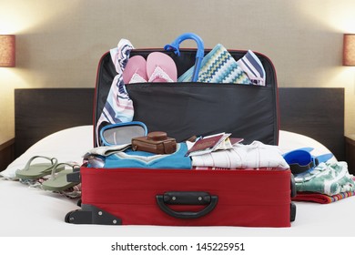 Open Suitcase On Bed