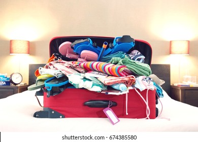 Open Suitcase On Bed