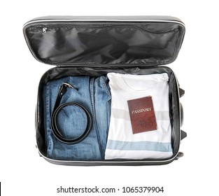 Open Suitcase With Packed Things On White Background, Top View