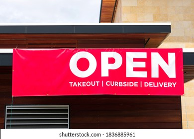 Open For Takeout, Curbside And Delivery Outdoor Advertisement Banner On Business Building Exterior