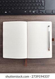 Open Tan Leather Notebook With Lined Pages And Keyboard On Wooden Desk Flat Lay
