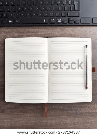 Open Tan Leather Notebook With Lined Pages And Keyboard On Wooden Desk Flat Lay