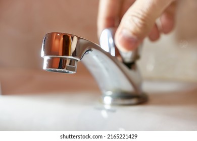 Open the tap, but the water does not flow. There is no water in the water supply. - Shutterstock ID 2165221429