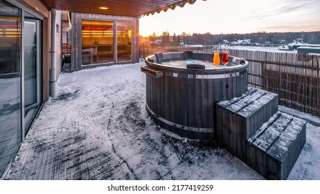 Open Terrace With Hot Outdoor Wooden Bath Tub At Winter. Luxury Private House. Modern Cottage.