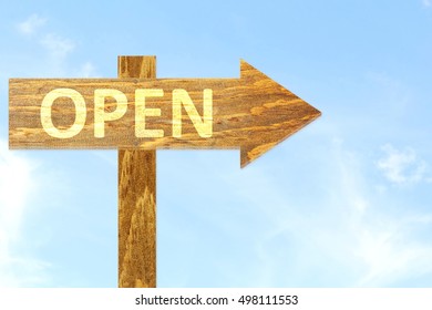 Open Text On Wooden Arrow Sign In Sky Background