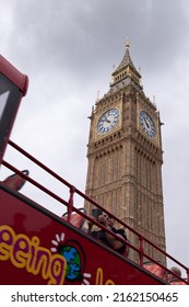 Open Top Bus Under The Elizabeth Tower On An Overcast Day In London, Taken 21st May 2022.