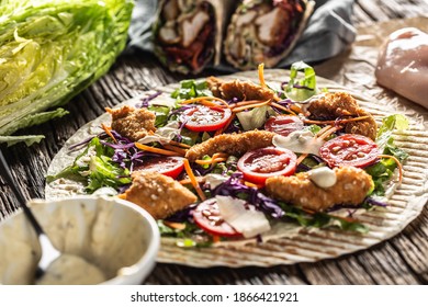 Open Tortilla With Chicken Nuggets, Chery Tomatoes, Red Cabbage, Salad, Carrot Stripes And Parmesan Shavings.