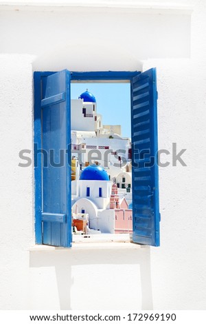 Open traditional Greek blue window on Santorini island, Greece