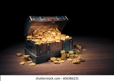 Open treasure chest filled with gold coins / HIgh contrast image - Shutterstock ID 606386231