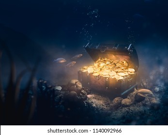 Open treasure chest sunken at the bottom of the sea / high contrast image
