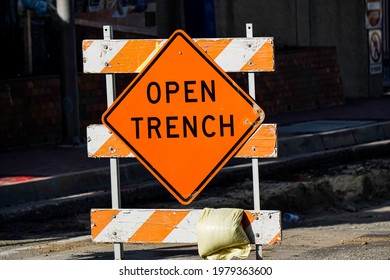 Open Trench Sign On Road Work Construction Site