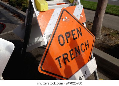 Open Trench Sign And Road Barricade                               