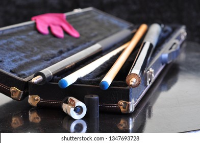 Open trunk cue case and the cues for the game of pool - Shutterstock ID 1347693728