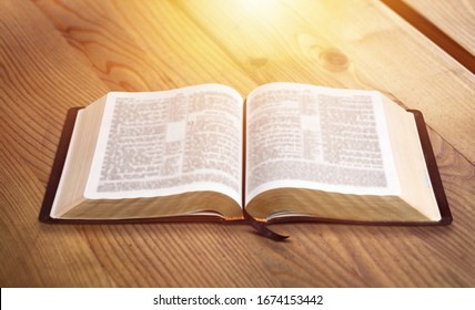 Open Vintage Christian Bible On The Desk