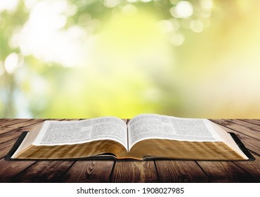 Open Vintage Christian Bible On Desk