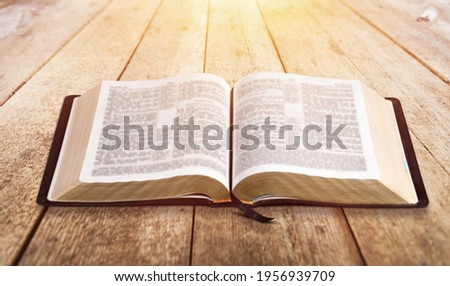 Open vintage christian bible on desk