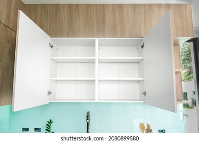 Open wall cabinet with empty shelves for product display, clean white cabinet, cover white melamine board or wainscoting cover white melamine in kitchen.