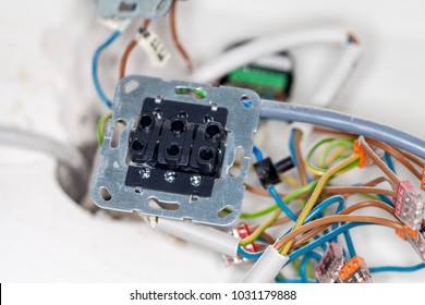 an open wall socket on construction site