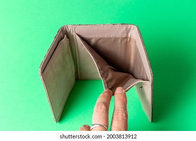 Open Wallet On A White Background. Poverty Concept. Below The Poverty Line. High Quality Photo
