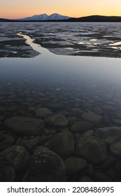 Open Water In Front Of Frozen Lake