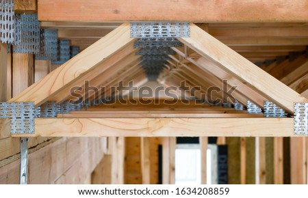 open web design wooden floor trusses closeup in framed construction made with steel connector plates