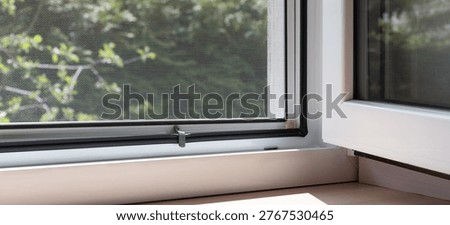 Open window with mosquito net screen and soft sunlight, mesh texture with copy space, clean home interior, fresh air and ventilation concept, minimal background for banner design