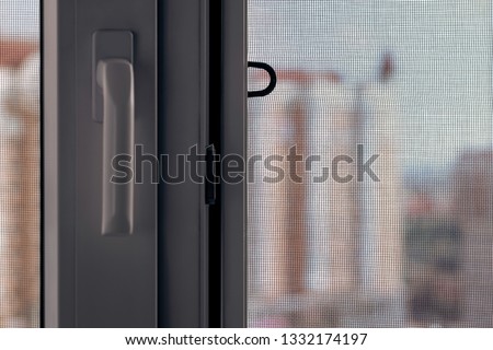 Open window with a mosquito screen to prevent insects and bugs, like flies, bees, mosquitoes or wasps from entering
