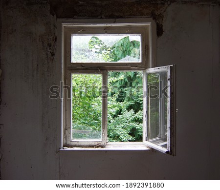 open window in an old abandoned house, lost place