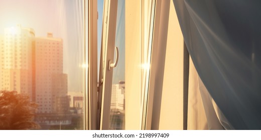 Open Window Plastic Frame And Wind Blowing And Swaying White Curtain At Sunset Indoor