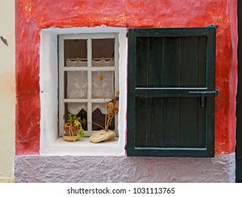 Open window in a red wall