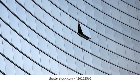 An open window in a row of similar dark office windows depicting a uniqueness concept - Shutterstock ID 426132568