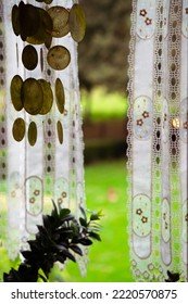 Open Window With Wind Chime, White Curtains, Plant And Dog In The Background