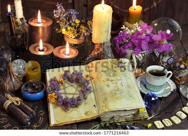 Open\
witch book with spells, black candles and cup of coffee. Esoteric,\
wicca and occult background with magic objects, fortune telling and\
divination ritual, Halloween mystic background.\
