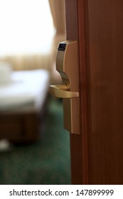 Open Wooden Door Of The Hotel Room