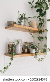 Open Wooden Shelves In The Kitchen With Jars And Houseplant, Pantry. View Of The Kitchen. Selective Focus. Sustainable Living Eco Friendly Kitchen