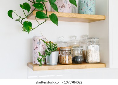 Open Wooden Shelves In The Kitchen, Pantry. View Of The Kitchen